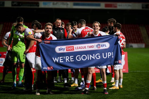 Mandatory Credit: Photo by Robbie Stephenson JMP Shutterstock (11878432e) Cheltenham Town celebrate promotion out of Sky Bet League Two into Sky Bet League One Cheltenham Town v Carlisle United, UK - 27 Apr 2021 EDITORIAL USE ONLY No use with unauthorised audio, video, data, fixture lists (outside the EU), club league logos or live services. Online in-match use limited to 45 images (+15 in extra time). No use to emulate moving images. No use in betting, games or single club league player publications services. Cheltenham Town v Carlisle United, UK - 27 Apr 2021 EDITORIAL USE ONLY No use with unauthorised audio, video, data, fixture lists (outside the EU), club league logos or live services. Online in-match use limited to 45 images (+15 in extra time). No use to emulate moving images. No use in betting, games or Copyright: xRobbiexStephenson JMP Shutterstockx 11878432e