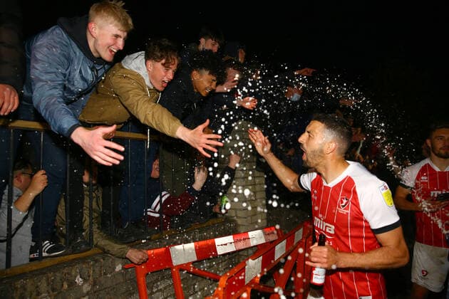 Mandatory Credit: Photo by Kieran McManus BPI Shutterstock (11877712am) Liam Sercombe of Cheltenham Town celebrates with the fans outside the stadium after winning promotion from League Two Cheltenham Town v Carlisle United, EFL Sky Bet League Two, Football, The Jonny-Rocks Stadium, Cheltenham, UK - 27 Apr 2021 EDITORIAL USE ONLY No use with unauthorised audio, video, data, fixture lists, club league logos or live services. Online in-match use limited to 120 images, no video emulation. No use in betting, games or single club league player publications. Cheltenham Town v Carlisle United, EFL Sky Bet League Two, Football, The Jonny-Rocks Stadium, Cheltenham, UK - 27 Apr 2021 EDITORIAL USE ONLY No use with unauthorised audio, video, data, fixture lists, club league logos or live services. Online in-match use limited to 120 images, no video emulation. No use in betting, games or single club league player publications. Copyright: xKieranxMcManus BPI Shutterstockx 11877712am
