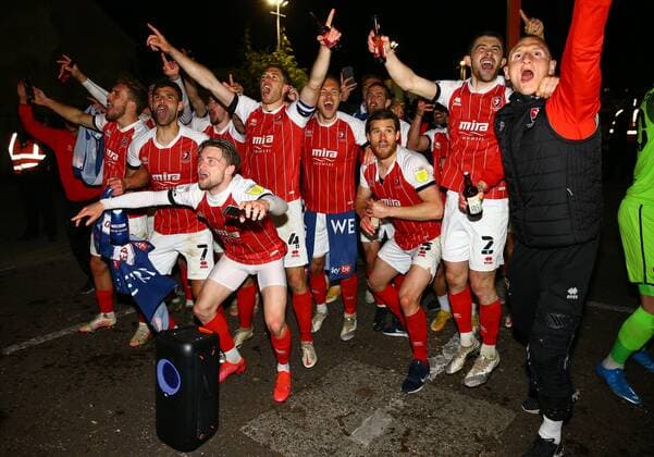 Mandatory Credit: Photo by Kieran McManus BPI Shutterstock (11877712ak) Cheltenham Town players celebrate with their fans outside the stadium after winning promotion from League Two Cheltenham Town v Carlisle United, EFL Sky Bet League Two, Football, The Jonny-Rocks Stadium, Cheltenham, UK - 27 Apr 2021 EDITORIAL USE ONLY No use with unauthorised audio, video, data, fixture lists, club league logos or live services. Online in-match use limited to 120 images, no video emulation. No use in betting, games or single club league player publications. Cheltenham Town v Carlisle United, EFL Sky Bet League Two, Football, The Jonny-Rocks Stadium, Cheltenham, UK - 27 Apr 2021 EDITORIAL USE ONLY No use with unauthorised audio, video, data, fixture lists, club league logos or live services. Online in-match use limited to 120 images, no video emulation. No use in betting, games or single club league player publications. Copyright: xKieranxMcManus BPI Shutterstockx 11877712ak