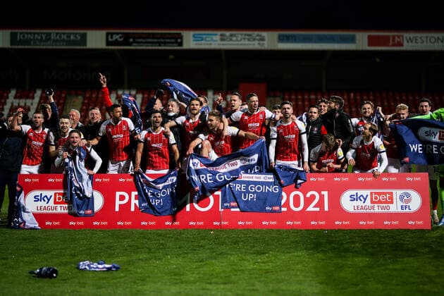 Mandatory Credit: Photo by Robbie Stephenson JMP Shutterstock (11878432j) Cheltenham Town celebrate promotion out of Sky Bet League Two into Sky Bet League One Cheltenham Town v Carlisle United, UK - 27 Apr 2021 EDITORIAL USE ONLY No use with unauthorised audio, video, data, fixture lists (outside the EU), club league logos or live services. Online in-match use limited to 45 images (+15 in extra time). No use to emulate moving images. No use in betting, games or single club league player publications services. Cheltenham Town v Carlisle United, UK - 27 Apr 2021 EDITORIAL USE ONLY No use with unauthorised audio, video, data, fixture lists (outside the EU), club league logos or live services. Online in-match use limited to 45 images (+15 in extra time). No use to emulate moving images. No use in betting, games or Copyright: xRobbiexStephenson JMP Shutterstockx 11878432j