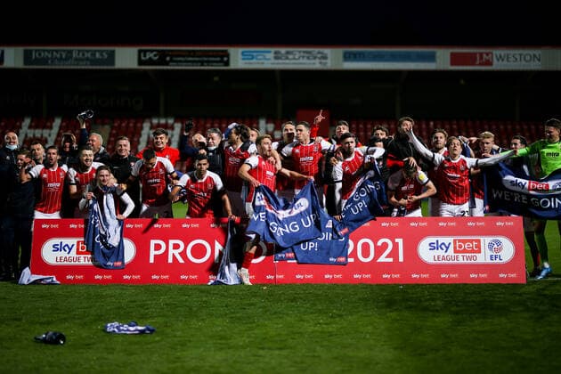 Mandatory Credit: Photo by Robbie Stephenson JMP Shutterstock (11878432k) Cheltenham Town celebrate promotion out of Sky Bet League Two into Sky Bet League One Cheltenham Town v Carlisle United, UK - 27 Apr 2021 EDITORIAL USE ONLY No use with unauthorised audio, video, data, fixture lists (outside the EU), club league logos or live services. Online in-match use limited to 45 images (+15 in extra time). No use to emulate moving images. No use in betting, games or single club league player publications services. Cheltenham Town v Carlisle United, UK - 27 Apr 2021 EDITORIAL USE ONLY No use with unauthorised audio, video, data, fixture lists (outside the EU), club league logos or live services. Online in-match use limited to 45 images (+15 in extra time). No use to emulate moving images. No use in betting, games or Copyright: xRobbiexStephenson JMP Shutterstockx 11878432k