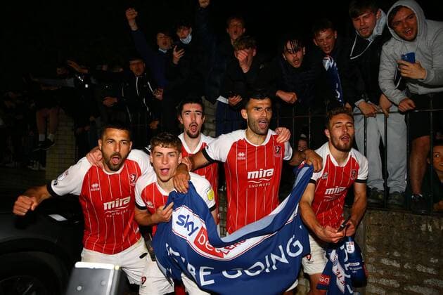 Mandatory Credit: Photo by Kieran McManus BPI Shutterstock (11877712ag) Cheltenham Town players celebrate with their fans outside the stadium after winning promotion from League Two Cheltenham Town v Carlisle United, EFL Sky Bet League Two, Football, The Jonny-Rocks Stadium, Cheltenham, UK - 27 Apr 2021 EDITORIAL USE ONLY No use with unauthorised audio, video, data, fixture lists, club league logos or live services. Online in-match use limited to 120 images, no video emulation. No use in betting, games or single club league player publications. Cheltenham Town v Carlisle United, EFL Sky Bet League Two, Football, The Jonny-Rocks Stadium, Cheltenham, UK - 27 Apr 2021 EDITORIAL USE ONLY No use with unauthorised audio, video, data, fixture lists, club league logos or live services. Online in-match use limited to 120 images, no video emulation. No use in betting, games or single club league player publications. Copyright: xKieranxMcManus BPI Shutterstockx 11877712ag