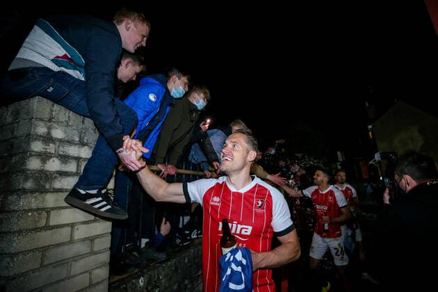 Mandatory Credit: Photo by Robbie Stephenson JMP Shutterstock (11878432cj) Cheltenham Town celebrate promotion out of Sky Bet League Two into Sky Bet League One with fans Cheltenham Town v Carlisle United, UK - 27 Apr 2021 EDITORIAL USE ONLY No use with unauthorised audio, video, data, fixture lists (outside the EU), club league logos or live services. Online in-match use limited to 45 images (+15 in extra time). No use to emulate moving images. No use in betting, games or single club league player publications services. Cheltenham Town v Carlisle United, UK - 27 Apr 2021 EDITORIAL USE ONLY No use with unauthorised audio, video, data, fixture lists (outside the EU), club league logos or live services. Online in-match use limited to 45 images (+15 in extra time). No use to emulate moving images. No use in betting, games or Copyright: xRobbiexStephenson JMP Shutterstockx 11878432cj