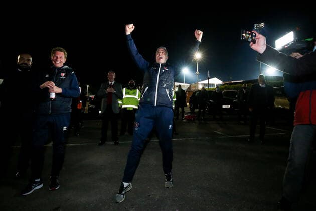 Mandatory Credit: Photo by Robbie Stephenson JMP Shutterstock (11878432dc) Cheltenham Town manager Michael Duff celebrates promotion out of Sky Bet League Two into Sky Bet League One with fans Cheltenham Town v Carlisle United, UK - 27 Apr 2021 EDITORIAL USE ONLY No use with unauthorised audio, video, data, fixture lists (outside the EU), club league logos or live services. Online in-match use limited to 45 images (+15 in extra time). No use to emulate moving images. No use in betting, games or single club league player publications services. Cheltenham Town v Carlisle United, UK - 27 Apr 2021 EDITORIAL USE ONLY No use with unauthorised audio, video, data, fixture lists (outside the EU), club league logos or live services. Online in-match use limited to 45 images (+15 in extra time). No use to emulate moving images. No use in betting, games or Copyright: xRobbiexStephenson JMP Shutterstockx 11878432dc