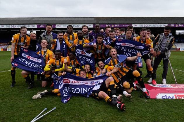 Mandatory Credit: Photo by Joe Toth BPI Shutterstock (11893216ez) Cambridge United players celebrate winning promotion to EFL Sky Bet League One Cambridge United v Grimsby Town, EFL Sky Bet League Two, Football, The Abbey Stadium, Cambridge, UK - 08 May 2021 EDITORIAL USE ONLY No use with unauthorised audio, video, data, fixture lists, club league logos or live services. Online in-match use limited to 120 images, no video emulation. No use in betting, games or single club league player publications. Cambridge United v Grimsby Town, EFL Sky Bet League Two, Football, The Abbey Stadium, Cambridge, UK - 08 May 2021 EDITORIAL USE ONLY No use with unauthorised audio, video, data, fixture lists, club league logos or live services. Online in-match use limited to 120 images, no video emulation. No use in betting, games or single club league player publications. Copyright: xJoexToth BPI Shutterstockx 11893216ez