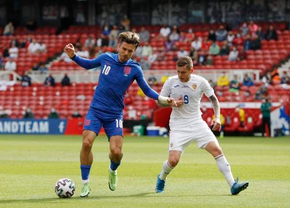 Middlesbrough, England, 6th June 2021. Jack Grealish of England holds off Alexandru Cicaldau of Romania during the International Friendly, Länderspiel, Nationalmannschaft match at the Riverside Stadium, Middlesbrough. Picture credit should read: Darren Staples Sportimage EDITORIAL USE ONLY. No use with unauthorised audio, video, data, fixture lists, club league logos or live services. Online in-match use limited to 120 images, no video emulation. No use in betting, games or single club league player publications. SPI-1079-0028
