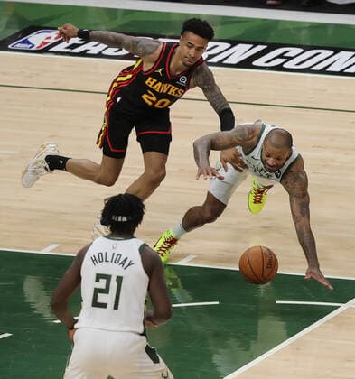 July 1, 2021, Milwaukee, WI, USA: The Atlanta Hawks John Colllins (20) turns the ball over against the Milwaukee Bucks P.J. Tucker during the second quarter in Game 5 of the NBA, Basketball Herren, USA Eastern Conference Finals at Fiserv Forum on Thursday, July 1, 2021, in Milwaukee. The Bucks won, 123-112, for a 3-2 series lead. Milwaukee USA - ZUMAm67_ 0123798774st Copyright: xCurtisxComptonx