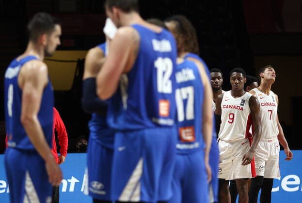July 3, 2021, Victoria, BC, Canada: Canada s Andrew Wiggins, RJ Barrett, and Dwight Powell look on during a timeout between the Czech Republic during the second half of FIBA Men s Olympic Qualifying semifinal basketball action at Memorial Arena in Victoria, B.C., on Saturday, July 3, 2021. Andrew Wiggins,RJ Barrett,Dwight Powell - ZUMAc35_ 20210703_zaf_c35_031 Copyright: xChadxHipolitox