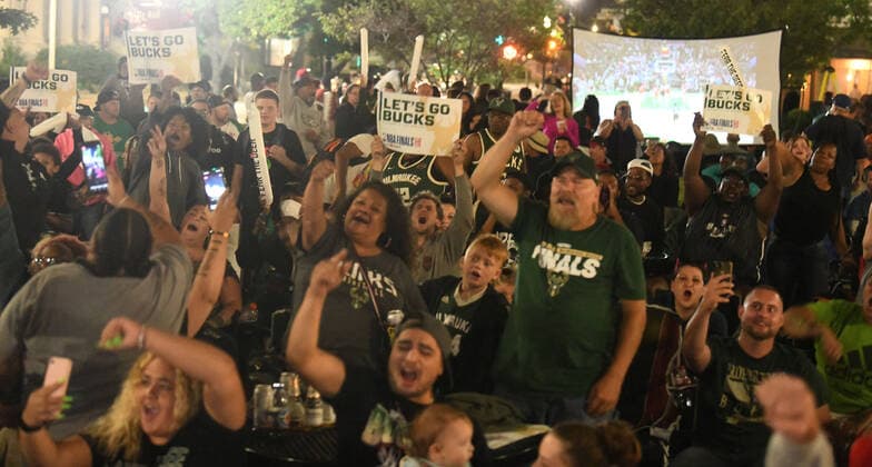 July 20, 2021, Racine, Wisconsin, USA: Fans cheer as a crowd estimated at up to 1,000 people watches the final minutes of the Milwaukee Bucks 105-98 victory over the Phoenix Suns to win the NBA, Basketball Herren, USA Championship at the â€oeDeer District Downtown†in Racine, Wisconsin Tuesday July 20, 2021. It was their first championship in 50 years. The â€oeDeer District Downtown,†modeled after the Deer District outside the Bucks arena in Milwaukee, enabled fans to gather on Monument Square in the middle of downtown and watch the game on large screen TVs. Racine USA - ZUMAh154 20210720_znp_h154_004 Copyright: xMarkxHertzbergx