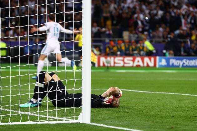 Mandatory Credit: Photo by Kieran Mcmanus BPI Shutterstock (9694071fk) Loris Karius of Liverpool shows a look of dejection as Gareth Bale of Real Madrid celebrates scoring his sides third goal Real Madrid v Liverpool, UEFA Champions League Final, Olimpiyskiy National Sports Complex Stadium, Kiev, UA, 26 May 2018 Real Madrid v Liverpool, UEFA Champions League Final, Olimpiyskiy National Sports Complex Stadium, Kiev, UA, 26 May 2018 Copyright: xKieranxMcmanus BPI Shutterstockx 9694071fk