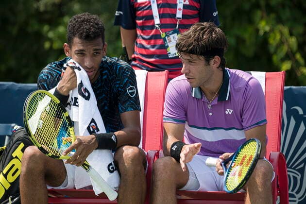 August 9, 2021, Toronto, on, Canada: Canada s Felix Auger-Aliassime, left, and Alexis Galarneau speak while on break of play against Russia s Karen Khachanov and Andrey Rublev during Men s National Bank Open doubles tennis action in Toronto on Monday, Aug., 9, 2021. Canada News - August 9, 2021 - ZUMAc35_ 20210809_zaf_c35_069 Copyright: xChristopherxKatsarovx