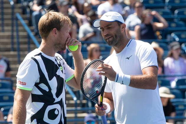 August 14, 2021, Toronto, on, Canada: Kevin Krawietz, left, of Germany, and Horia Tecau, of Romania, confer on the court during their 7-6 7-6 loss to Croatia s Nikola Mektic and Mate Pavic in National Bank Open men s tennis action in Toronto, Saturday, Aug. 14, 2021 Kevin Krawietz; Horia Tecau . - ZUMAc35_ 20210814_zaf_c35_013 Copyright: xChrisxYoungx