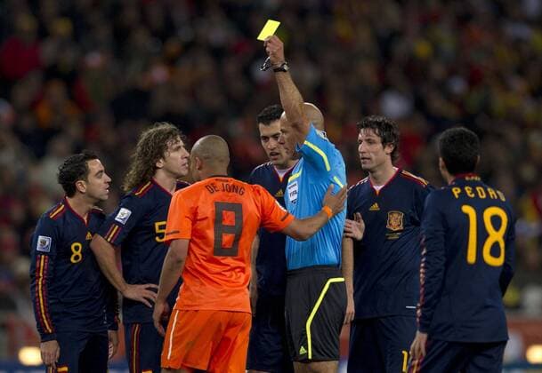 Mandatory Credit: Photo by Back Page Images Shutterstock (1206333as) Nigel De Jong of Netherlands is shown a yellow card by Referee Howard Webb of England for his kick to the chest on Xabi Alonso of Spain Netherlands v Spain, 2010 FIFA World Cup, WM, Weltmeisterschaft, Fussball Final football match, Soccer City, Johannesburg, South Africa - 11 Jul 2010 EDITORIAL USE ONLY Netherlands v Spain, 2010 FIFA World Cup Final football match, Soccer City, Johannesburg, South Africa - 11 Jul 2010 EDITORIAL USE ONLY Copyright: xBackxPagexImages Shutterstockx 1206333as