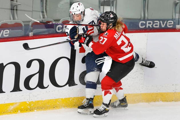 Canada player Emma Maltais, rt, hits USA player Cayla Barnes, lt, during IIHF Women s World Championship, WM, Weltmeisterschaft gold medal play in Calgary, Alberta, Canada on Aug. 31, 2021. digital photo by Larry MacDougal Emma Maltais, Cayla Barnes
