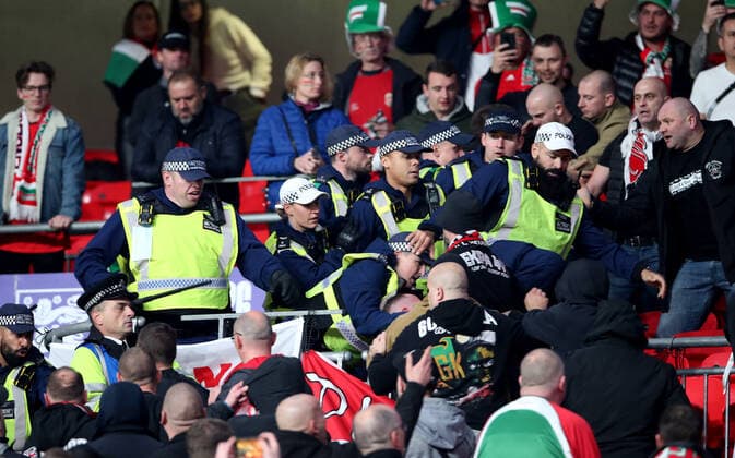 Mandatory Credit: Photo by Matt Impey Shutterstock (12534940t) Crowd trouble after Police move in to arrest a Hungary fan for racial aggravation and they fight back eventually resulting in the Policbacking away from the situation England v Hungary, Football, World Cup Qualifying, Group I, Wembley Stadium, Wembley, London, UK - 12 10 2021 Editorial use only England v Hungary, Football, World Cup Qualifying, Group I, Wembley Stadium, Wembley, London, UK - 12 10 2021 Editorial use only Copyright: xMattxImpey Shutterstockx 12534940t