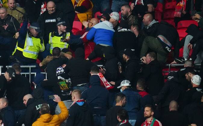 Mandatory Credit: Photo by Javier Garcia Shutterstock (12534018ew) Hungary fans clash with police England v Hungary, FIFA World Cup, WM, Weltmeisterschaft, Fussball 2022 Qualifying, Group I, Football, Wembley Stadium, London, UK - 12 Oct 2021 EDITORIAL USE ONLY No use with unauthorised audio, video, data, fixture lists, club league logos or live services. Online in-match use limited to 120 images, no video emulation. No use in betting, games or single club league player publications. England v Hungary, FIFA World Cup 2022 Qualifying, Group I, Football, Wembley Stadium, London, UK - 12 Oct 2021 EDITORIAL USE ONLY No use with unauthorised audio, video, data, fixture lists, club league logos or live services. Online in-match use limited to 120 images, no video emulation. No use in betting, games or single club league player publications. Copyright: xJavierxGarcia Shutterstockx 12534018ew