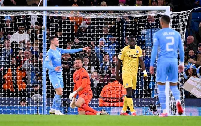 Manchester, United Kingdom - November 03 : Riyad Mahrez forward of Manchester City celebrates scoring a goal & Simon Mignolet goalkeeper of Club Brugge during the UEFA Champions League Group stage A match between Manchester City FC and Club Brugge on November 3, 2021 in Manchester, United Kingdom, 3 11 2021 ( Manchester City v Club Brugge - UEFA Champions League PhotoNews Panoramic