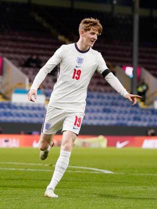 Burnley, England, 11th November 2021. Anthony Gordon of England celebrates scoring the first goal on his debut during the UEFA EURO, EM, Europameisterschaft,Fussball Under-21 Qualifying match at Turf Moor, Burnley. Picture credit should read: Andrew Yates Sportimage EDITORIAL USE ONLY. No use with unauthorised audio, video, data, fixture lists, club league logos or live services. Online in-match use limited to 120 images, no video emulation. No use in betting, games or single club league player publications. SPI-1315-0013