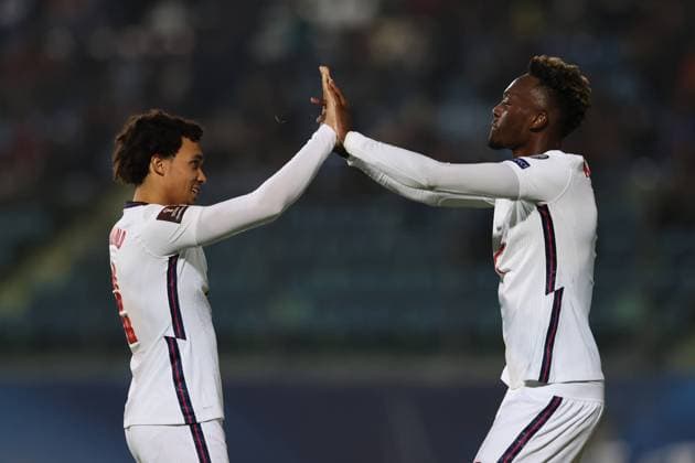 Fußball, WM Quali, San Marino - England Serravalle, Italy, 15th November 2021. Tammy Abraham of England celebrates with team mate Trent Alexander-Arnold after scoring to give the side a 9-0 lead during the FIFA World Cup, WM, Weltmeisterschaft, Fussball 2022 - European Qualifying match at San Marino Stadium, Serravalle. Picture credit should read: Jonathan Moscrop Sportimage EDITORIAL USE ONLY. No use with unauthorised audio, video, data, fixture lists, club league logos or live services. Online in-match use limited to 120 images, no video emulation. No use in betting, games or single club league player publications. SPI-1312-0040