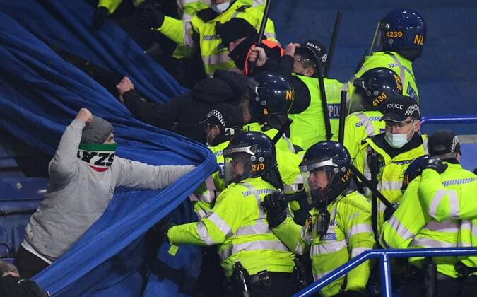 Mandatory Credit: Photo by Anna Gowthorpe Shutterstock (12617592ai) Legia Warsaw fans fight police officers Leicester City v Legia Warsaw, UEFA Europa League, Group C, Football, The King Power Stadium, Leicester, UK - 25 Nov 2021 EDITORIAL USE ONLY No use with unauthorised audio, video, data, fixture lists, club league logos or live services. Online in-match use limited to 120 images, no video emulation. No use in betting, games or single club league player publications. Leicester City v Legia Warsaw, UEFA Europa League, Group C, Football, The King Power Stadium, Leicester, UK - 25 Nov 2021 EDITORIAL USE ONLY No use with unauthorised audio, video, data, fixture lists, club league logos or live services. Online in-match use limited to 120 images, no video emulation. No use in betting, games or single club league player publications. Copyright: xAnnaxGowthorpe Shutterstockx 12617592ai