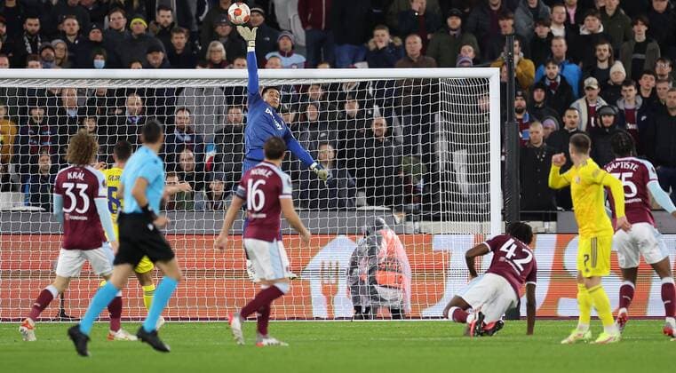 Mandatory Credit: Photo by Simon Dael Shutterstock (12637595ap) West Ham goalkeeper Alphonse Areola makes a save from Luka Ivanusec of Dinamo Zagreb West Ham United v Dinamo Zagreb, UEFA Europa League, Group H, Football, London Stadium, London, UK - 09 Dec 2021 EDITORIAL USE ONLY No use with unauthorised audio, video, data, fixture lists, club league logos or live services. Online in-match use limited to 120 images, no video emulation. No use in betting, games or single club league player publications. West Ham United v Dinamo Zagreb, UEFA Europa League, Group H, Football, London Stadium, London, UK - 09 Dec 2021 EDITORIAL USE ONLY No use with unauthorised audio, video, data, fixture lists, club league logos or live services. Online in-match use limited to 120 images, no video emulation. No use in betting, games or single club league player publications. Copyright: xSimonxDael Shutterstockx 12637595ap