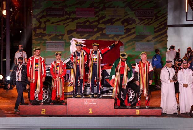 201 Al-Attiyah Nasser (qat), Baumel Batthieu (fra), Toyota Gazoo Racing, Toyota GR DKR Hilux T1+, Auto FIA T1 T2, W2RC, portrait, podium with 211 Loeb Sebastien (fra), Lurquin Fabian (bel), Bahrain Raid Xtreme, BRX Prodrive Hunter T1+, Auto FIA T1 T2, W2RC and 205 Al Rajhi Yazeed (sau), Orr Michael (gbr), Overdrive Toyota, Toyota Hilux Overdrive, Auto FIA T1 T2, W2RC during the Podium Finish of the Dakar Rally 2022, on January 14th 2022 in Jeddah, Saudi Arabia - AUTO - DAKAR 2022 - PODIUM FINISH DPPI Panoramic JDR55427