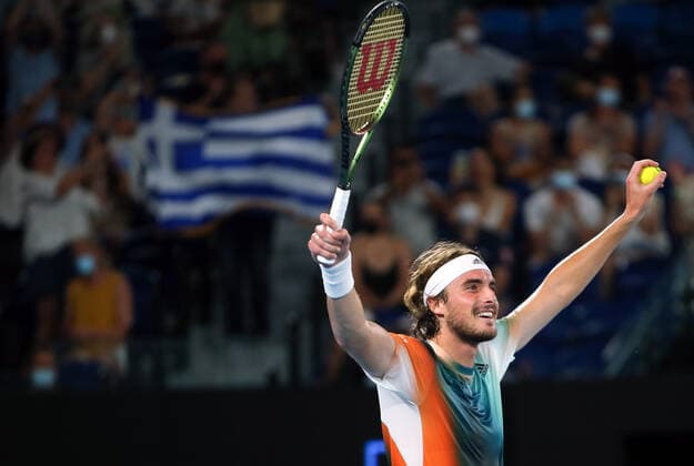 Mandatory Credit: Photo by Ella Ling Shutterstock (12765099fc) Stefanos Tsitsipas celebrates in front of a Greek flag after victory in his fourth round match Australian Open, Day Eight, Tennis, Melbourne Park, Melbourne, Australia - 24 Jan 2022 Australian Open, Day Eight, Tennis, Melbourne Park, Melbourne, Australia - 24 Jan 2022 Copyright: xEllaxLing Shutterstockx 12765099fc
