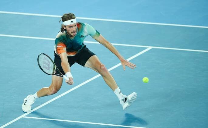 Mandatory Credit: Photo by Ella Ling Shutterstock (12775251cx) Stefanos Tsitsipas in semi final action Australian Open, Day Twelve, Tennis, Melbourne Park, Melbourne, Australia - 28 Jan 2022 Australian Open, Day Twelve, Tennis, Melbourne Park, Melbourne, Australia - 28 Jan 2022 Copyright: xEllaxLing Shutterstockx 12775251cx