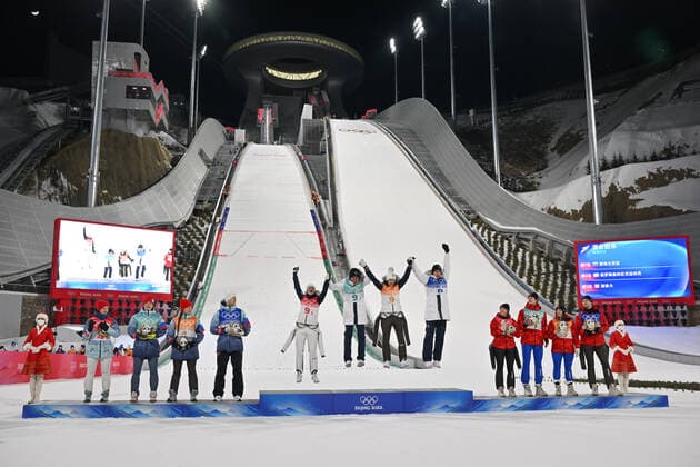 (220207) -- ZHANGJIAKOU, Feb. 7, 2022 -- Gold medalists (C) of Team Slovenia jump during the flower ceremony afger Ski jumping, Skispringen, Ski, nordisch Mixed Team Final Round at the National Ski Jumping Centre in Zhangjiakou, north China s Hebei Province, Feb. 7, 2022. ) (BEIJING2022) CHINA-ZHANGJIAKOU-OLYMPIC Winter games, Winterspiele,Spiele, Summer games SKI JUMPING-MIXED TEAM(CN) JiangxKehong