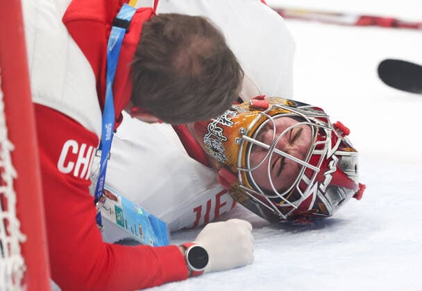 (220215) -- BEIJING, Feb. 15, 2022 -- Goalkeeper Shimisi Jieruimi (C) of China is injured during the Ice hockey, Eishockey men s qualification play-off of Beijing 2022 Winter Olympics between Canada and China at Wukesong Sports Centre, in Beijing, capital of China, Feb. 15, 2022. ) (BEIJING2022)CHINA-BEIJING-OLYMPIC Winter games, Winterspiele,Spiele, Summer games ICE HOCKEY-MEN S QUALIFICATION PLAY-OFF-CAN VS CHN (CN) MengxYongmin