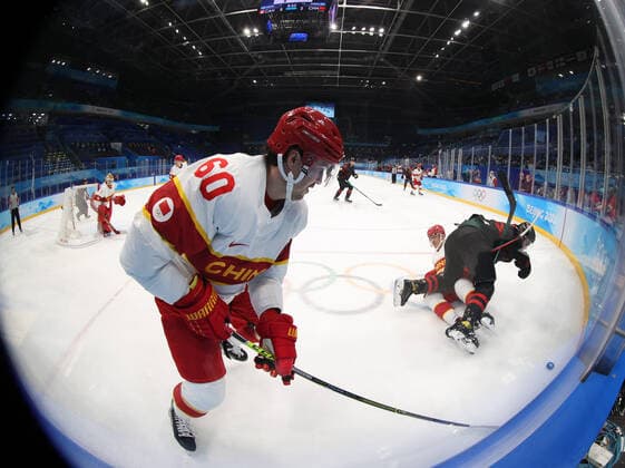 (220215) -- BEIJING, Feb. 15, 2022 -- Aoxibofu Dannisi (front) of China competes during the Ice hockey, Eishockey men s qualification play-off of Beijing 2022 Winter Olympics between Canada and China at Wukesong Sports Centre, in Beijing, capital of China, Feb. 15, 2022. ) (BEIJING2022)CHINA-BEIJING-OLYMPIC Winter games, Winterspiele,Spiele, Summer games ICE HOCKEY-MEN S QUALIFICATION PLAY-OFF-CAN VS CHN (CN) MengxYongmin