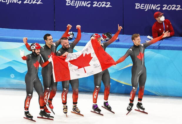 (220216) -- BEIJING, Feb. 16, 2022 -- Team Canada celebrate after winning the gold medal in the men s 5,000m relay final of short track Speed skating, Eisschnelllauf at Capital Indoor Stadium in Beijing, capital of China, Feb. 16, 2022. ) (BEIJING2022)CHINA-BEIJING-OLYMPIC Winter games, Winterspiele,Spiele, Summer games SHORT TRACK SPEED SKATING (CN) XuxZijian