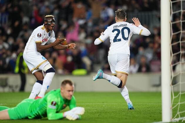 Mandatory Credit: Photo by Bagu Blanco Pressinphoto Shutterstock (12811548v) Piotr Zielinski of SCC Napoli celebrates with is teammate Victor Osimhen after scoring the opening goal FC Barcelona, Barca v SCC Napoli, UEFA Europa League 2021-2022, round of 16, first leg. Football, Camp Nou Stadium, Barcelona, Spain - 17 Feb 2021 Editorial use only FC Barcelona v SCC Napoli, UEFA Europa League 2021-2022, round of 16, first leg. Football, Camp Nou Stadium, Barcelona, Spain - 17 Feb 2021 Editorial use only Copyright: xBaguxBlanco Pressinphoto Shutterstockx 12811548v