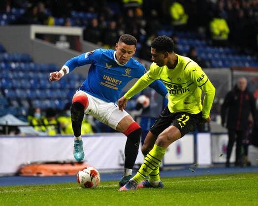 Mandatory Credit: Photo by Stuart Wallace Shutterstock (12820548y) Rangers captain James Tavernier beats Jude Bellingham of Borussia Dortmund Rangers v Borussia Dortmund, UEFA Europa League, Play-offs, Second Leg, Football, Ibrox Stadium, Glasgow, UK - 24 Feb 2022 EDITORIAL USE ONLY No use with unauthorised audio, video, data, fixture lists, club league logos or live services. Online in-match use limited to 120 images, no video emulation. No use in betting, games or single club league player publications. Rangers v Borussia Dortmund, UEFA Europa League, Play-offs, Second Leg, Football, Ibrox Stadium, Glasgow, UK - 24 Feb 2022 EDITORIAL USE ONLY No use with unauthorised audio, video, data, fixture lists, club league logos or live services. Online in-match use limited to 120 images, no video emulation. No use in betting, games or single club league player publications. Copyright: xStuartxWallace Shutterstockx 12820548y