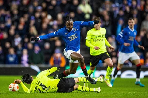 Mandatory Credit: Photo by Kirk O Rourke Rangers FC Shutterstock (12821153du) Joe Aribo of Rangers jumps over Emre Can of Borussia Dortmund during the last 32 Europa League match at Ibrox Stadium, Glasgow. Rangers v Borussia Dortmund, UEFA Europa League, Play-offs, Second Leg, Football, Ibrox Stadium, Glasgow, UK - 24 Feb 2022 Rangers v Borussia Dortmund, UEFA Europa League, Play-offs, Second Leg, Football, Ibrox Stadium, Glasgow, UK - 24 Feb 2022 Copyright: xKirkxO Rourke RangersxFC Shutterstockx 12821153du