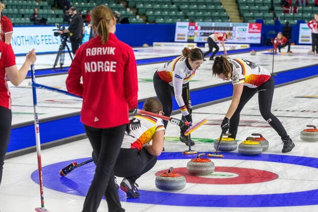 March 20, 2022, Prince George, BC, CANADA: Germany third Emira Abbes, left, and lead Analena Jentsch sweep in front of a stone as it enters the house while Norway skip Marianne Rorvik looks on at CN Centre on Sunday evening during at the Women s World Curling in Prince George, B.C., Sunday, March 20, 2022. Canada News - March 20, 2022 - ZUMAc35_ 20220320_zaf_c35_124 Copyright: xJamesxDoylex