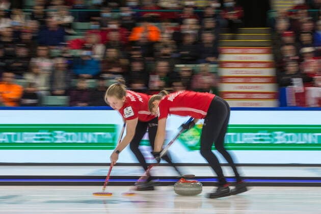 March 20, 2022, Prince George, BC, CANADA: Norway second Mille Haslev Nordbye, left, and lead Martine Ronning sweep in front of a stone at CN Centre on Sunday evening during at the Women s World Curling in Prince George, B.C., Sunday, March 20, 2022. Canada News - March 20, 2022 - ZUMAc35_ 20220320_zaf_c35_127 Copyright: xJamesxDoylex