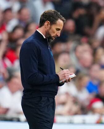 Mandatory Credit: Photo by Javier Garcia Shutterstock (12865321v) England manager Gareth Southgate writes in a notebook England v Switzerland, International Friendly, Länderspiel, Nationalmannschaft Football, Wembley Stadium, London, UK - 26 Mar 2022 EDITORIAL USE ONLY No use with unauthorised audio, video, data, fixture lists, club league logos or live services. Online in-match use limited to 120 images, no video emulation. No use in betting, games or single club league player publications. England v Switzerland, International Friendly, Football, Wembley Stadium, London, UK - 26 Mar 2022 EDITORIAL USE ONLY No use with unauthorised audio, video, data, fixture lists, club league logos or live services. Online in-match use limited to 120 images, no video emulation. No use in betting, games or single club league player publications. Copyright: xJavierxGarcia Shutterstockx 12865321v
