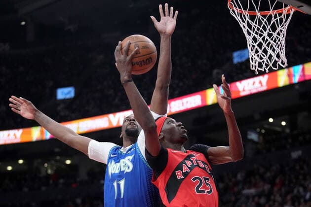March 30, 2022, TORONTO, ON, CANADA: Toronto Raptors forward Chris Boucher (25) gets his dunk rejected by Minnesota Timberwolves centre Naz Reid (11) during first half NBA, Basketball Herren, USA basketball action in Toronto, Wednesday, March 30, 2022. Canada News - March 30, 2022 - ZUMAc35_ 20220330_zaf_c35_141 Copyright: xNathanxDenettex