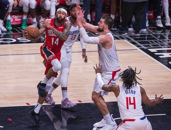 April 3, 2022, Los Angeles, California, USA: Brandon Ingram 14 of the New Orleans Pelicans passes the ball away from Paul George 13, Ivica Zubac 40 and Terance Mann 14 of the Los Angeles Clippers during their NBA, Basketball Herren, USA game on Sunday April 3, 2022 at Crypto.com Arena in Los Angeles, California. Clippers defeat Pelicans, 119-100. ARIANA RUIZ PI Los Angeles USA - ZUMAp124 20220403_zaa_p124_072 Copyright: xArianaxRuizx