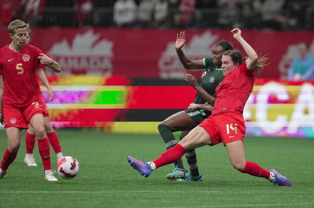 April 8, 2022, VANCOUVER, BC, CANADA: Canada s Vanessa Gilles, right, and Nigeria s Ifeoma Onumonu vie for the ball during the first half of a women s friendly soccer match, in Vancouver, on Friday, April 8, 2022. Canada News - April 8, 2022 - ZUMAc35_ 20220408_zaf_c35_201 Copyright: xDarrylxDyckx