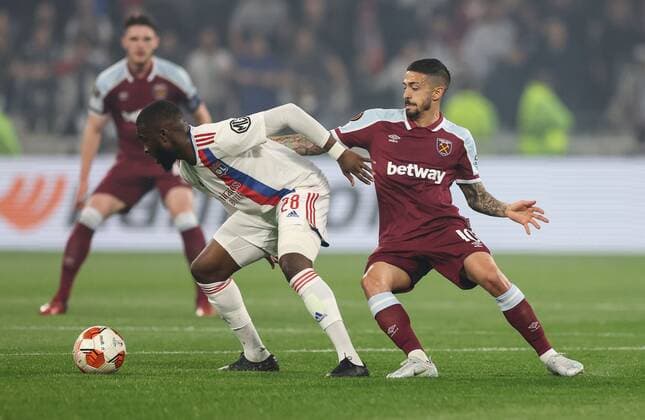 Mandatory Credit: Photo by Simon Dael Shutterstock (12893327ap) Tanguy NDombèlé of Lyon and Manuel Lanzini of West Ham United Olympique Lyonnais v West Ham United, UEFA Europa League, Quarter Final, Second Leg, Football, Groupama Stadium, Lyon, France - 14 Apr 2022 EDITORIAL USE ONLY No use with unauthorised audio, video, data, fixture lists, club league logos or live services. Online in-match use limited to 120 images, no video emulation. No use in betting, games or single club league player publications. Olympique Lyonnais v West Ham United, UEFA Europa League, Quarter Final, Second Leg, Football, Groupama Stadium, Lyon, France - 14 Apr 2022 EDITORIAL USE ONLY No use with unauthorised audio, video, data, fixture lists, club league logos or live services. Online in-match use limited to 120 images, no video emulation. No use in betting, games or single club league player publications. Copyright: xSimonxDael Shutterstockx 12893327ap