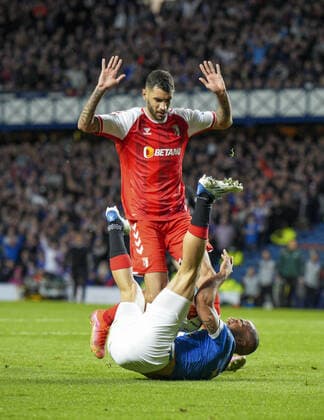 Mandatory Credit: Photo by Stuart Wallace Shutterstock (12893325ay) Kemar Roofe of Rangers fouled inside the penalty area by Vitor Tormena of SC Braga. Rangers v Braga, UEFA Europa League, Quarter Final, Second Leg, Football, Ibrox Stadium, Glasgow, UK - 14 Apr 2022 EDITORIAL USE ONLY No use with unauthorised audio, video, data, fixture lists, club league logos or live services. Online in-match use limited to 120 images, no video emulation. No use in betting, games or single club league player publications. Rangers v Braga, UEFA Europa League, Quarter Final, Second Leg, Football, Ibrox Stadium, Glasgow, UK - 14 Apr 2022 EDITORIAL USE ONLY No use with unauthorised audio, video, data, fixture lists, club league logos or live services. Online in-match use limited to 120 images, no video emulation. No use in betting, games or single club league player publications. Copyright: xStuartxWallace Shutterstockx 12893325ay