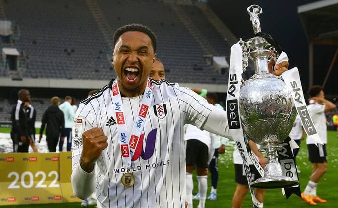Mandatory Credit: Photo by Kieran McManus Shutterstock (12917139ce) Kenny Tete of Fulham celebrates with the trophy Fulham v Luton Town, EFL Sky Bet Championship, Football, Craven Cottage, London, UK - 02 May 2022 EDITORIAL USE ONLY No use with unauthorised audio, video, data, fixture lists, club league logos or live services. Online in-match use limited to 120 images, no video emulation. No use in betting, games or single club league player publications. Fulham v Luton Town, EFL Sky Bet Championship, Football, Craven Cottage, London, UK - 02 May 2022 EDITORIAL USE ONLY No use with unauthorised audio, video, data, fixture lists, club league logos or live services. Online in-match use limited to 120 images, no video emulation. No use in betting, games or single club league player publications. Copyright: xKieranxMcManus Shutterstockx 12917139ce