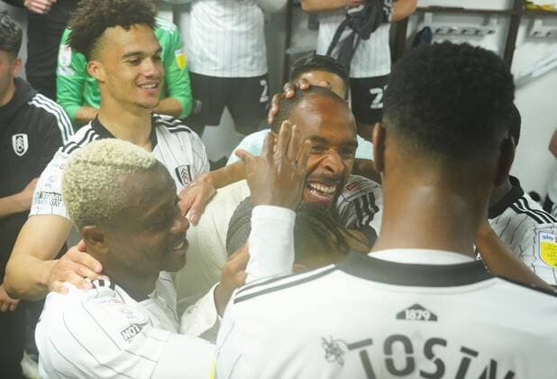 Mandatory Credit: Photo by Javier Garcia Shutterstock (12917135az) Denis Odoi joins the changing room celebrations Fulham v Luton Town, EFL Sky Bet Championship, Football, Craven Cottage, London, UK - 02 May 2022 EDITORIAL USE ONLY No use with unauthorised audio, video, data, fixture lists, club league logos or live services. Online in-match use limited to 120 images, no video emulation. No use in betting, games or single club league player publications. Fulham v Luton Town, EFL Sky Bet Championship, Football, Craven Cottage, London, UK - 02 May 2022 EDITORIAL USE ONLY No use with unauthorised audio, video, data, fixture lists, club league logos or live services. Online in-match use limited to 120 images, no video emulation. No use in betting, games or single club league player publications. Copyright: xJavierxGarcia Shutterstockx 12917135az