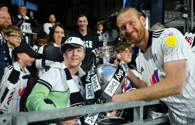 Mandatory Credit: Photo by Javier Garcia Shutterstock (12917135be) Tim Ream of Fulham poses with the trophy with Rhys Porter Fulham v Luton Town, EFL Sky Bet Championship, Football, Craven Cottage, London, UK - 02 May 2022 EDITORIAL USE ONLY No use with unauthorised audio, video, data, fixture lists, club league logos or live services. Online in-match use limited to 120 images, no video emulation. No use in betting, games or single club league player publications. Fulham v Luton Town, EFL Sky Bet Championship, Football, Craven Cottage, London, UK - 02 May 2022 EDITORIAL USE ONLY No use with unauthorised audio, video, data, fixture lists, club league logos or live services. Online in-match use limited to 120 images, no video emulation. No use in betting, games or single club league player publications. Copyright: xJavierxGarcia Shutterstockx 12917135be