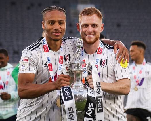 Mandatory Credit: Photo by Will Cooper JMP Shutterstock (12921095ep) Bobby Reid of Fulham and Harrison Reed of Fulham with the Championship trophy Fulham v Luton Town, UK - 02 May 2022 EDITORIAL USE ONLY No use with unauthorised audio, video, data, fixture lists (outside the EU), club league logos or live services. Online in-match use limited to 45 images (+15 in extra time). No use to emulate moving images. No use in betting, games or single club league player publications services. Fulham v Luton Town, UK - 02 May 2022 EDITORIAL USE ONLY No use with unauthorised audio, video, data, fixture lists (outside the EU), club league logos or live services. Online in-match use limited to 45 images (+15 in extra time). No use to emulate moving images. No use in betting, games or Copyright: xWillxCooper JMP Shutterstockx 12921095ep