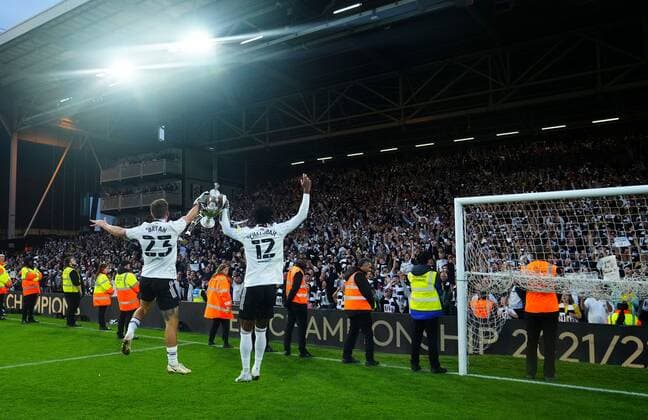 Mandatory Credit: Photo by Javier Garcia Shutterstock (12917135ey) Joe Bryan and Nathaniel Chalobah of Fulham jump with the trophy at the Hammersmith End Fulham v Luton Town, EFL Sky Bet Championship, Football, Craven Cottage, London, UK - 02 May 2022 EDITORIAL USE ONLY No use with unauthorised audio, video, data, fixture lists, club league logos or live services. Online in-match use limited to 120 images, no video emulation. No use in betting, games or single club league player publications. Fulham v Luton Town, EFL Sky Bet Championship, Football, Craven Cottage, London, UK - 02 May 2022 EDITORIAL USE ONLY No use with unauthorised audio, video, data, fixture lists, club league logos or live services. Online in-match use limited to 120 images, no video emulation. No use in betting, games or single club league player publications. Copyright: xJavierxGarcia Shutterstockx 12917135ey