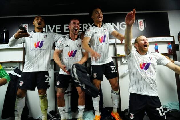 Mandatory Credit: Photo by Javier Garcia Shutterstock (12917135gz) Fulham players react when former team mate Denis Odoi walks into the changing room to join the celebrations Fulham v Luton Town, EFL Sky Bet Championship, Football, Craven Cottage, London, UK - 02 May 2022 EDITORIAL USE ONLY No use with unauthorised audio, video, data, fixture lists, club league logos or live services. Online in-match use limited to 120 images, no video emulation. No use in betting, games or single club league player publications. Fulham v Luton Town, EFL Sky Bet Championship, Football, Craven Cottage, London, UK - 02 May 2022 EDITORIAL USE ONLY No use with unauthorised audio, video, data, fixture lists, club league logos or live services. Online in-match use limited to 120 images, no video emulation. No use in betting, games or single club league player publications. Copyright: xJavierxGarcia Shutterstockx 12917135gz