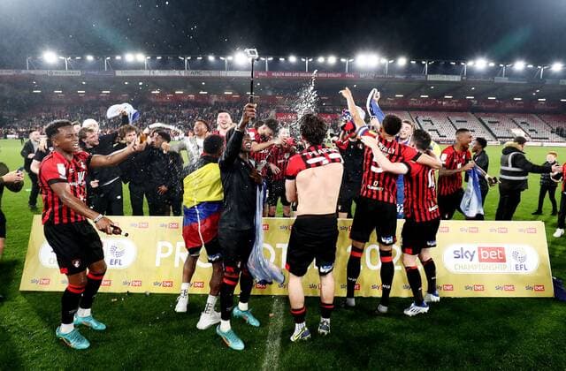 Mandatory Credit: Photo by James Marsh Shutterstock (12922043bk) Players celebrate after gaining promotion to the Premier League. AFC Bournemouth v Nottingham Forest, EFL Sky Bet Championship, Football, Vitality Stadium, Bournemouth, UK - 03 May 2022 EDITORIAL USE ONLY No use with unauthorised audio, video, data, fixture lists, club league logos or live services. Online in-match use limited to 120 images, no video emulation. No use in betting, games or single club league player publications. AFC Bournemouth v Nottingham Forest, EFL Sky Bet Championship, Football, Vitality Stadium, Bournemouth, UK - 03 May 2022 EDITORIAL USE ONLY No use with unauthorised audio, video, data, fixture lists, club league logos or live services. Online in-match use limited to 120 images, no video emulation. No use in betting, games or single club league player publications. Copyright: xJamesxMarsh Shutterstockx 12922043bk